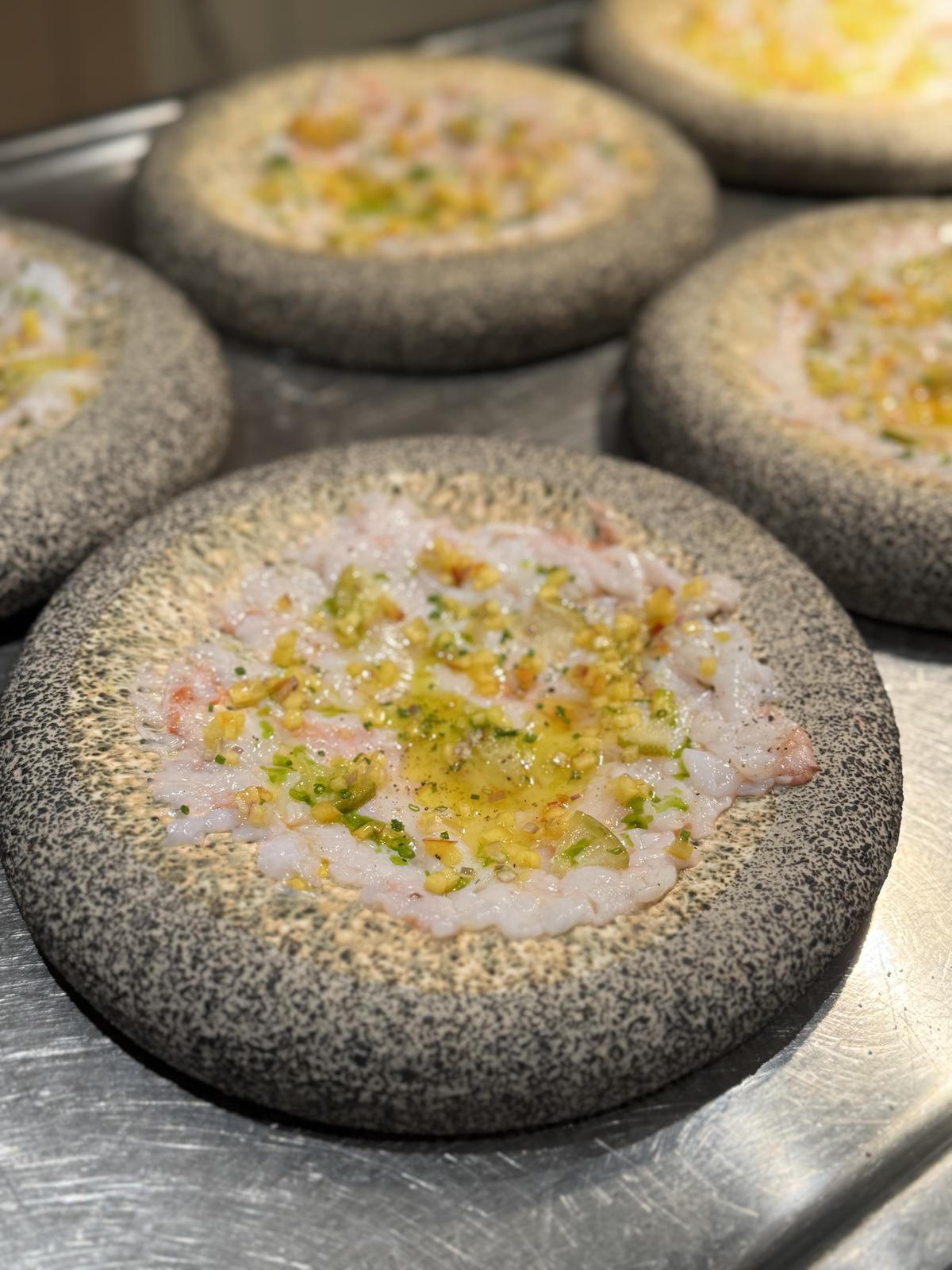 Shrimp crudo on stone platters